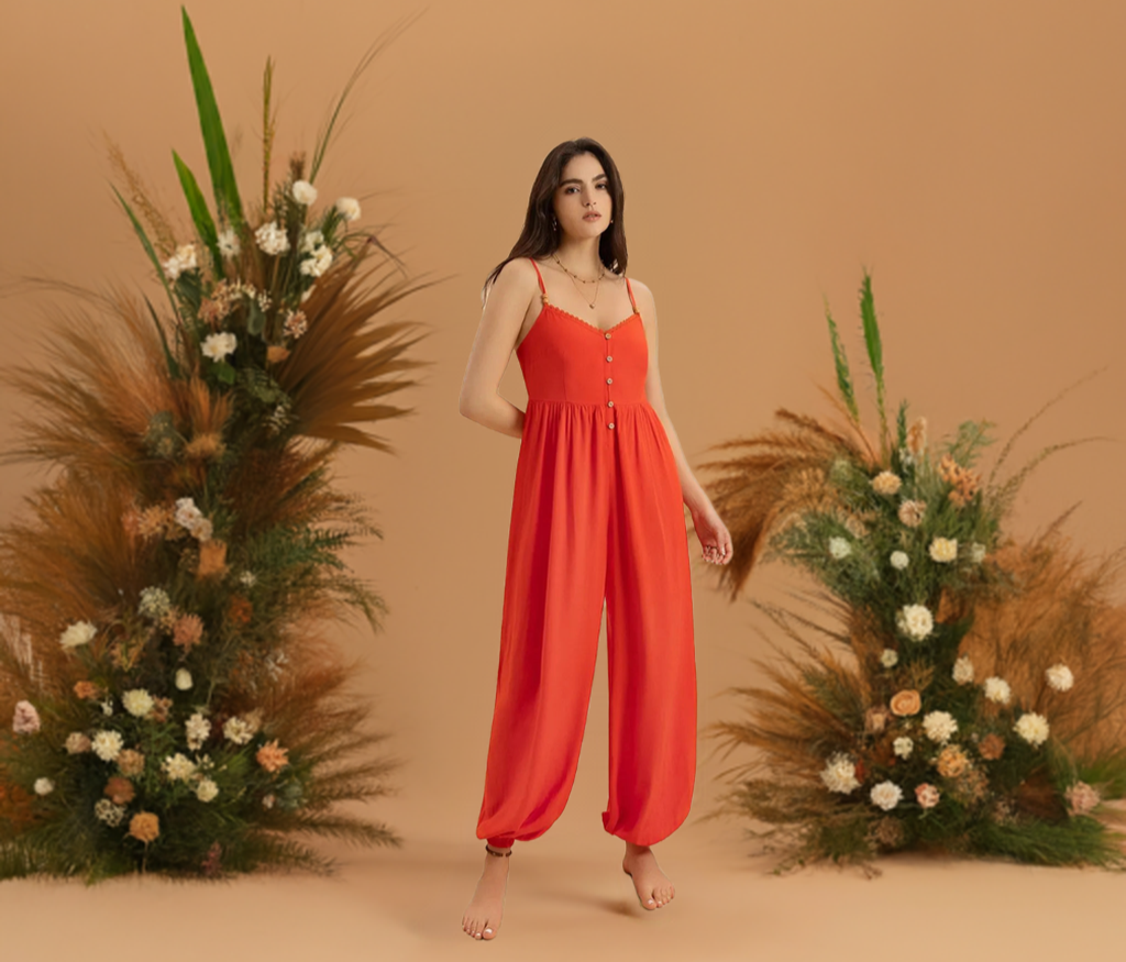 This vibrant orange V-neck jumpsuit is the perfect addition to your summer and spring wardrobe. Its spaghetti straps and lightweight fabric make it ideal for trips and traveling, whether on vacation or just running errands.