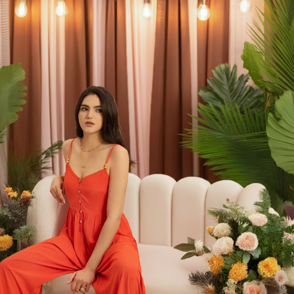 This vibrant orange V-neck jumpsuit is the perfect addition to your summer and spring wardrobe. Its spaghetti straps and lightweight fabric make it ideal for trips and traveling, whether on vacation or just running errands.