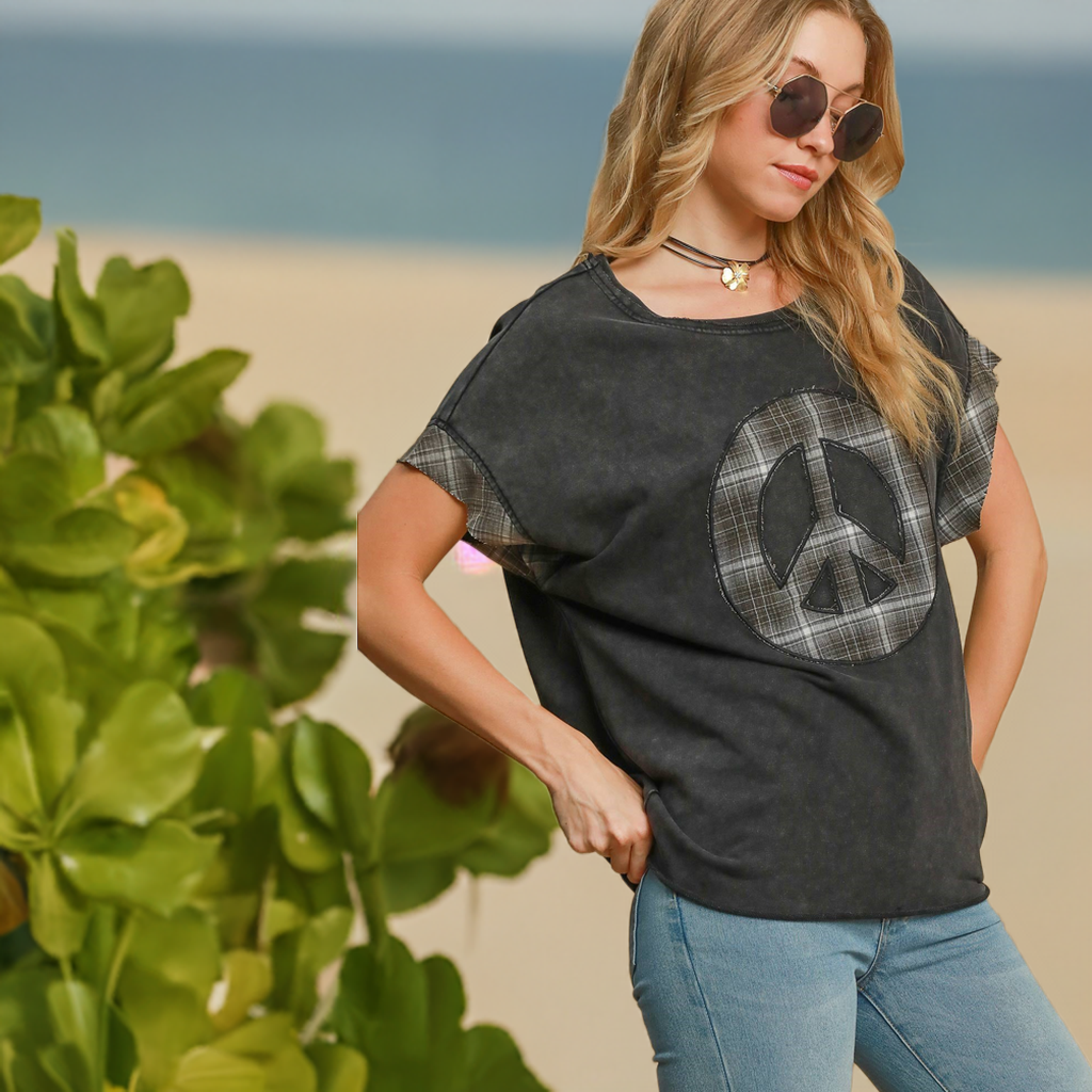 The Peace Applique Round Neck French Terry Top is a casual and cozy piece perfect for everyday wear. The peace sign applique adds a playful and positive touch to the classic design. 