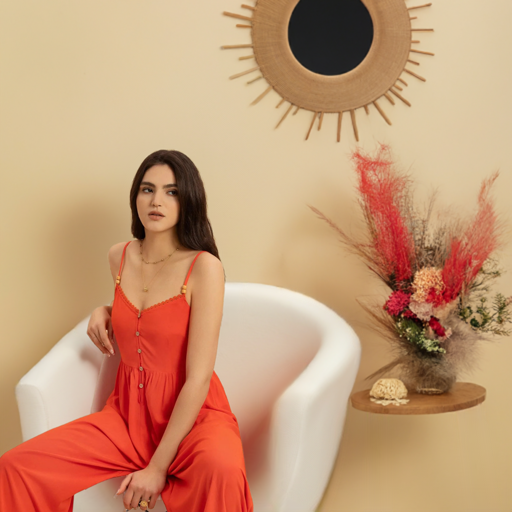 This vibrant orange V-neck jumpsuit is the perfect addition to your summer and spring wardrobe. Its spaghetti straps and lightweight fabric make it ideal for trips and traveling, whether on vacation or just running errands.
