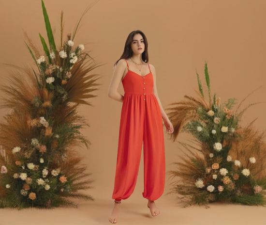 Womens Orange V-Neck Spaghetti Strap Jumpsuit. This vibrant orange V-neck jumpsuit is the perfect addition to your summer and spring wardrobe. 