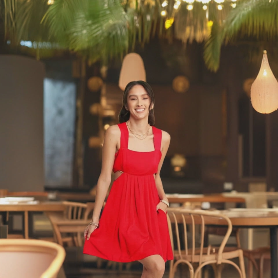 The washed satin cutout skirt bandeau red mini dress is a luxurious and stylish choice for a special occasion. 