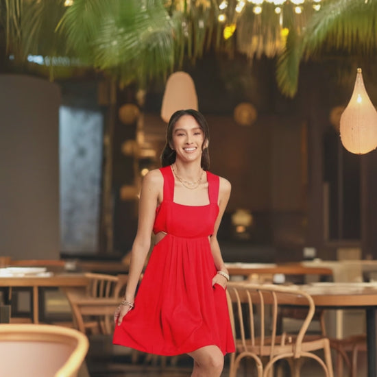The washed satin cutout skirt bandeau red mini dress is a luxurious and stylish choice for a special occasion. 